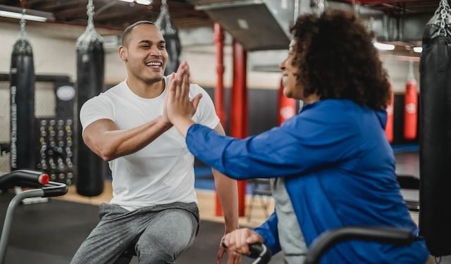 A woman giving high five to her coach